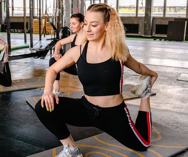 Smiling woman feeling energetic and full of life after a yoga session.